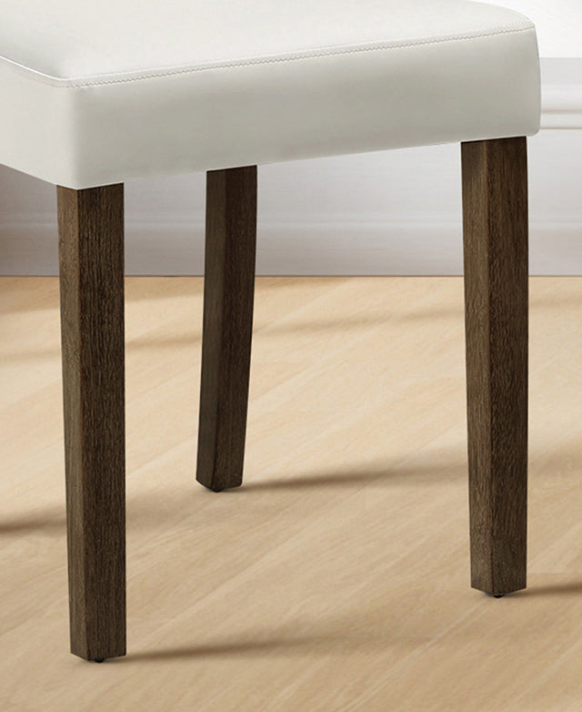 Chair with white cushioned seat and dark wooden legs on a wooden floor.